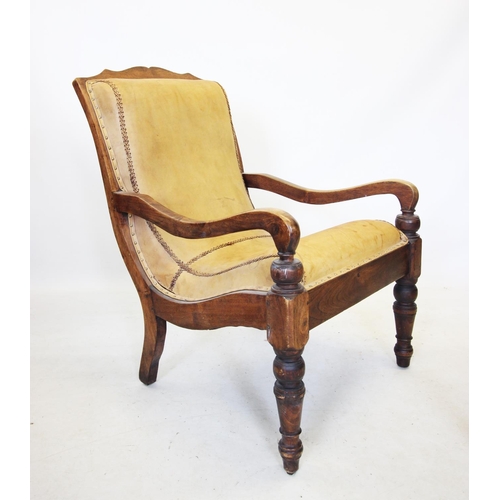 708 - A pair of 19th century style hardwood plantation chairs, the tan leather padded backs extending to d... 