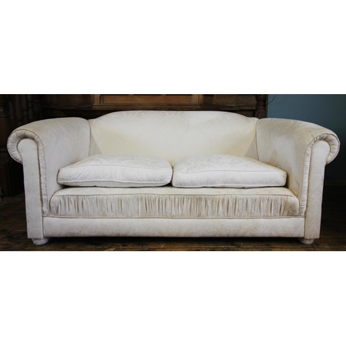 736 - A pair of contemporary Chesterfield type settees, in white fabric, the padded scroll arms enclosing ... 