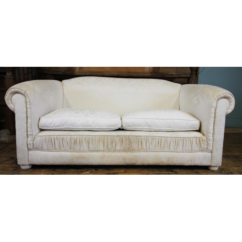 736 - A pair of contemporary Chesterfield type settees, in white fabric, the padded scroll arms enclosing ... 