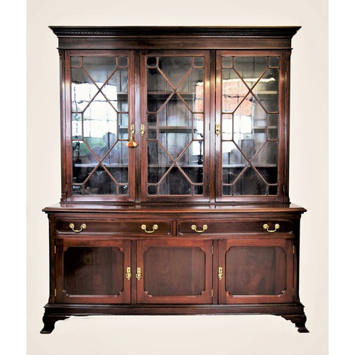 721 - An Edwardian mahogany library bookcase, the moulded cornice with a Greek key pattern frieze above th... 