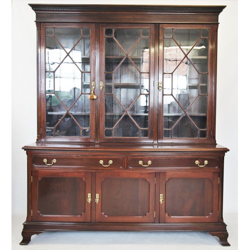 721 - An Edwardian mahogany library bookcase, the moulded cornice with a Greek key pattern frieze above th... 