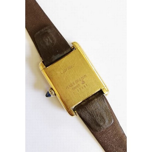 109 - A lady's gold plated Cartier Tank wristwatch, the rectangular cream dial with black Roman numerals, ... 