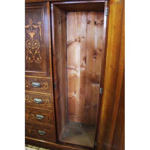 683 - A late 19th century rosewood compactum wardrobe, the moulded cornice above a frieze inlaid with scro... 