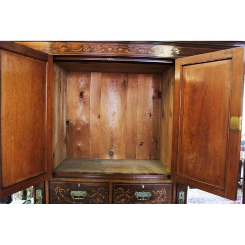 683 - A late 19th century rosewood compactum wardrobe, the moulded cornice above a frieze inlaid with scro... 