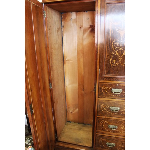 683 - A late 19th century rosewood compactum wardrobe, the moulded cornice above a frieze inlaid with scro... 