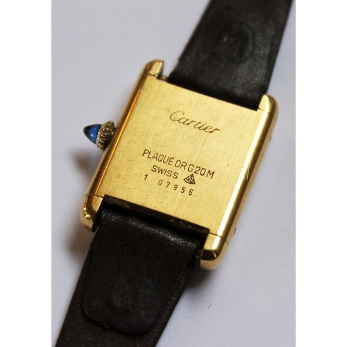 109 - A lady's gold plated Cartier Tank wristwatch, the rectangular cream dial with black Roman numerals, ... 