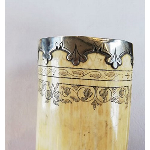 87 - A white metal mounted scrimshaw tusk pot, inscribed 'Frine favfer und fief' below the metal mounted ... 