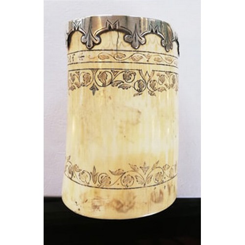 87 - A white metal mounted scrimshaw tusk pot, inscribed 'Frine favfer und fief' below the metal mounted ... 