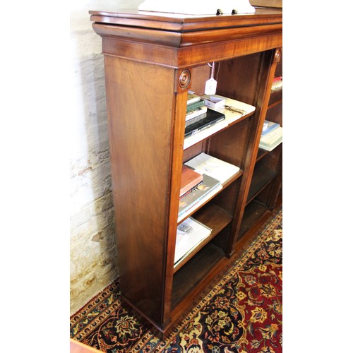 681 - A mid 19th century mahogany open bookcase, the rectangular top with a small break front above an arr... 