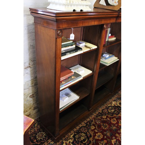 681 - A mid 19th century mahogany open bookcase, the rectangular top with a small break front above an arr... 