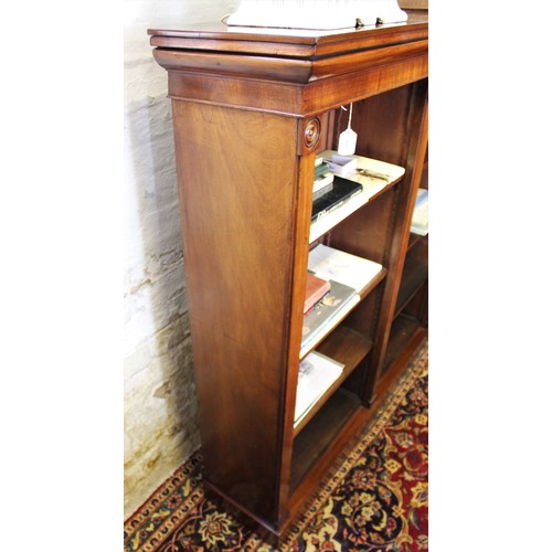 681 - A mid 19th century mahogany open bookcase, the rectangular top with a small break front above an arr... 