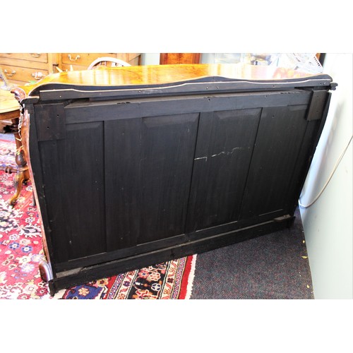 662 - A Victorian burr walnut credenza, the shaped moulded top with satinwood cross banding, above a gilt ... 