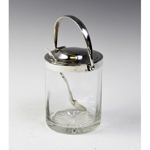 74 - An Asprey of London Patent silver topped glass preserve jar, of cylindrical form with mechanical swi... 