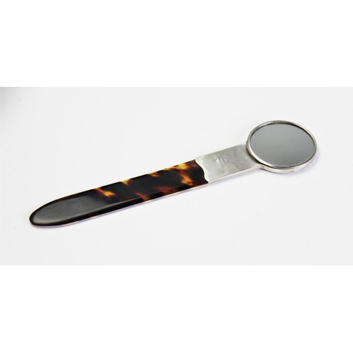 80 - An Edwardian silver mounted tortoiseshell combination hand mirror and page turner, Goldsmiths & Silv... 