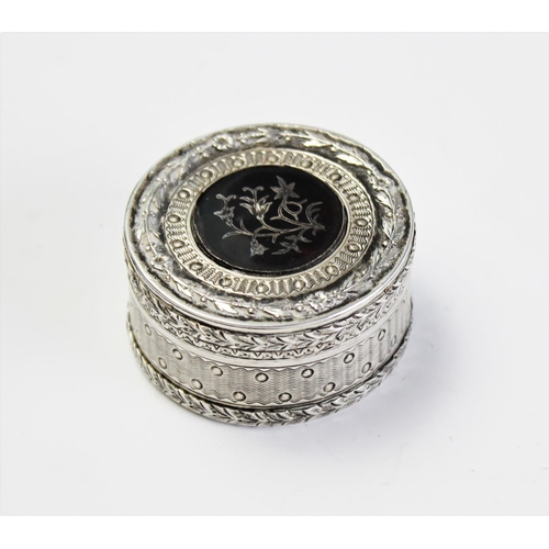 81 - A French silver and tortoiseshell patch box, 19th century, of circular form with removable cover enc... 