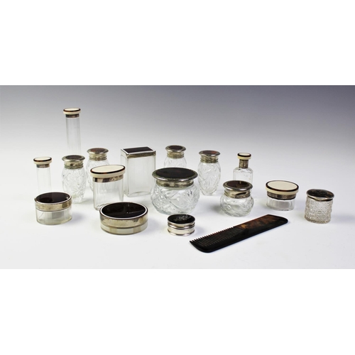 82 - A collection of dressing table jars, to include, a silver Victorian pill box with tortoiseshell inla... 