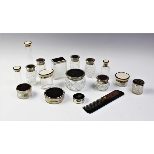 82 - A collection of dressing table jars, to include, a silver Victorian pill box with tortoiseshell inla... 