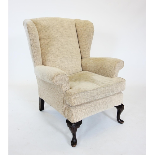 830 - A George III style wing back armchair, early 20th century, with padded wing backs over padded scroll... 