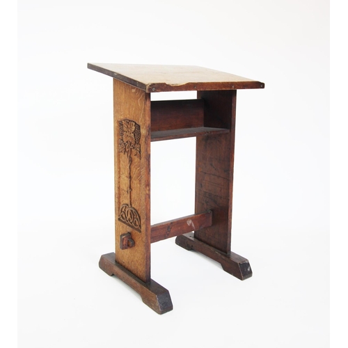 849 - A late Victorian oak lectern, the angled book rest raised upon two rectangular uprights, the left ha... 