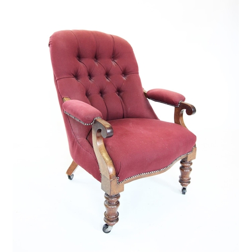 856 - A mid 19th century button back mahogany frame open armchair, the arched padded back above mahogany d... 