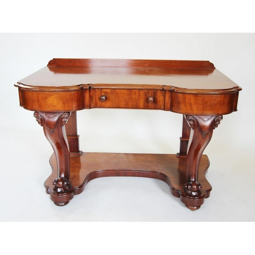 858 - A Victorian mahogany dressing table, the invert shaped moulded top above a single frieze drawer, rai... 