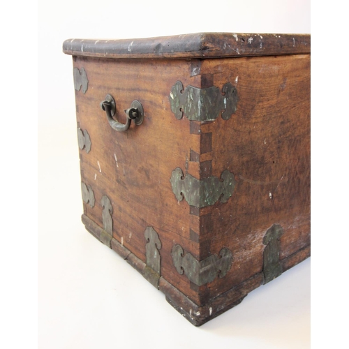 860A - A 19th century hardwood chest, applied with shaped brass corner brackets and brass side swing handle... 