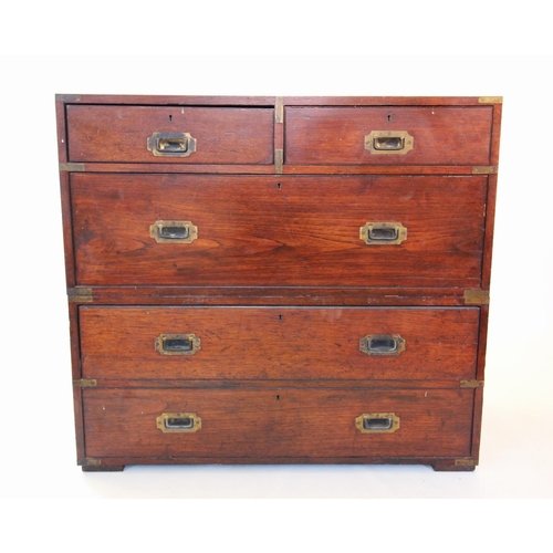 864 - A mid 19th century oak campaign chest of drawers, with an arrangement of two short over three long d... 