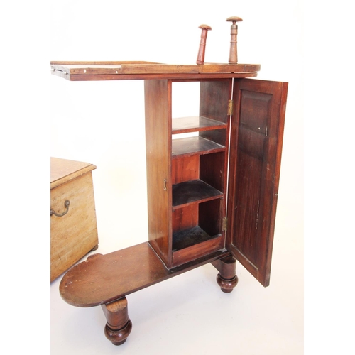 865 - A Victorian mahogany commode stool, with flushing system, the hinged lid enclosing a turned cover an... 