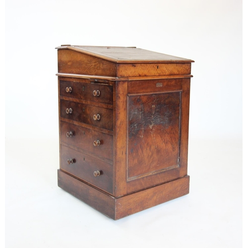 866 - A Victorian mahogany davenport, the hinged and sliding writing slope enclosing two small drawers, ab... 