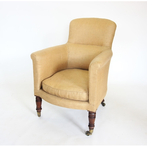 867 - A Victorian tub chair, with a padded back rest and padded arms enclosing the cushion seat, raised up... 