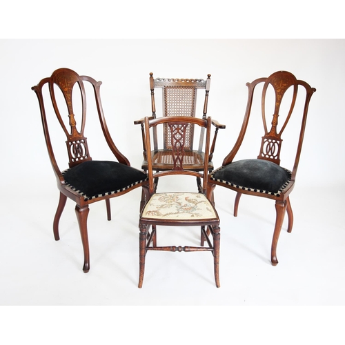 879 - A pair of inlaid Edwardian mahogany side chairs, each with an open work splat above a padded seat an... 