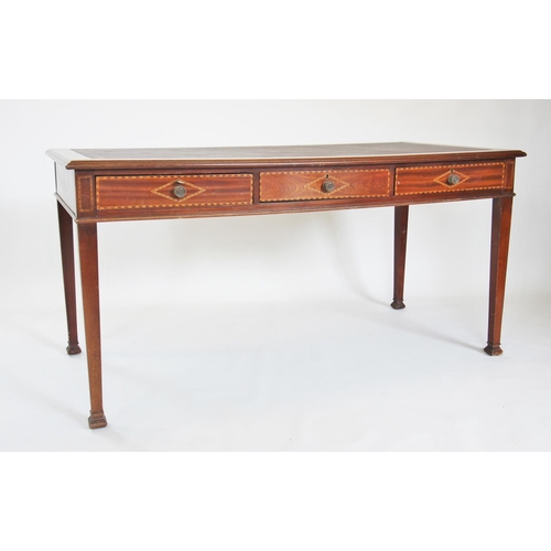 888 - An Edwardian mahogany writing desk, the rectangular moulded top inset with a Moroccan red leather an... 