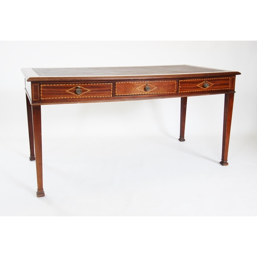 888 - An Edwardian mahogany writing desk, the rectangular moulded top inset with a Moroccan red leather an... 