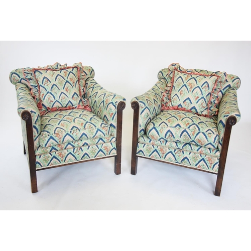 899 - An Edwardian three piece lounge suite, the two seater sofa with a padded serpentine back rest above ... 