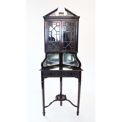 900 - An Edwardian Chinese Chippendale revival freestanding corner display cabinet, with an openwork broke... 