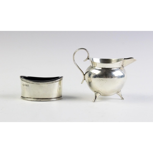 10 - A Victorian silver cream jug by Mappin & Webb, Sheffield 1896, the cauldron form jug with scrolling ... 