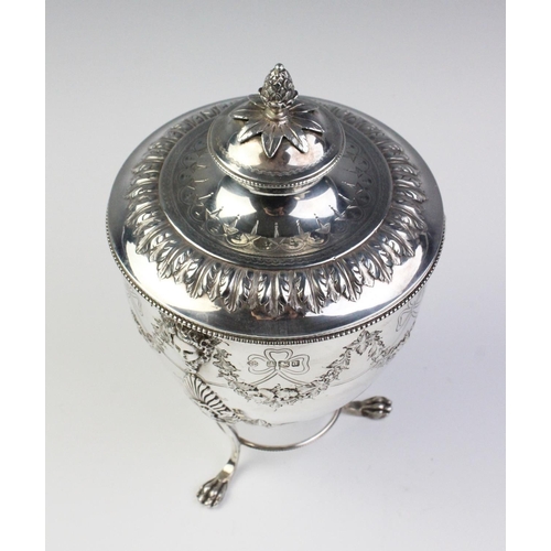13 - A late Victorian silver caddy by Martin, Hall & Co, Sheffield 1893, the urn shaped body resting on t... 