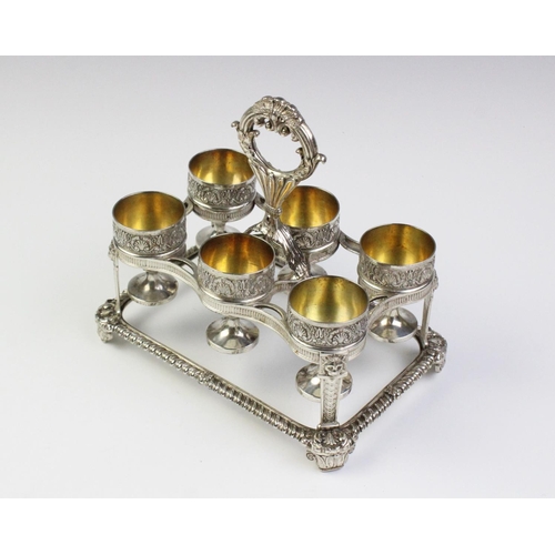 24 - A George III silver egg cruet by Phillip Rundell, London 1819, the rectangular stand with gadrooned ... 