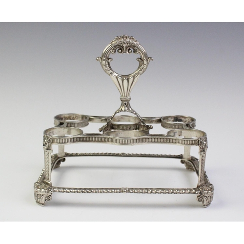 24 - A George III silver egg cruet by Phillip Rundell, London 1819, the rectangular stand with gadrooned ... 