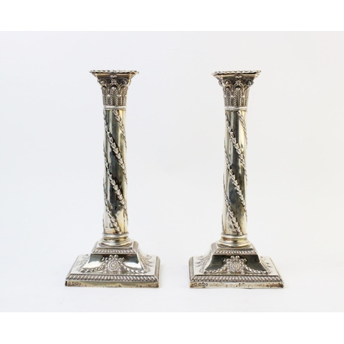 52 - A pair of Victorian silver candlesticks by Hawksworth, Eyre & Co Ltd, Sheffield 1896, each designed ... 