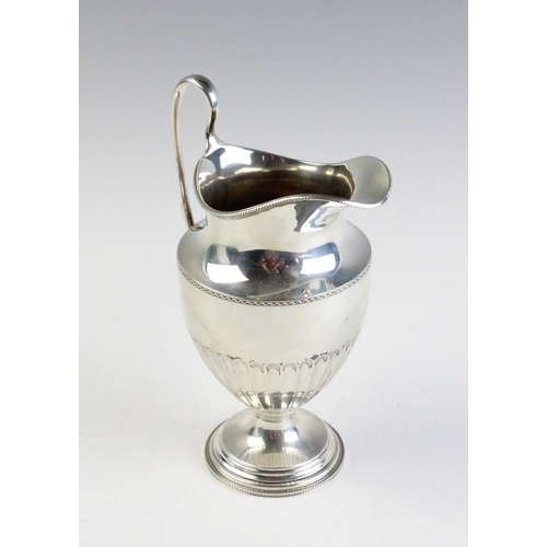 54 - A silver ewer by Thomas Bradbury & Sons Ltd, Sheffield 1922, of tapering form on stepped circular fo... 