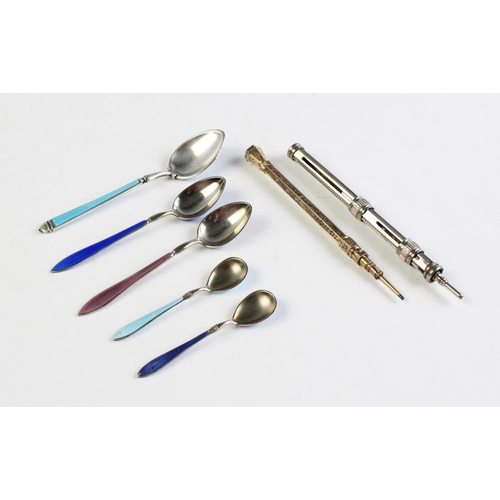 59 - An Edwardian silver, enamel and niello teaspoon, Sheffield 1904, 11cm long, together with a pair of ... 