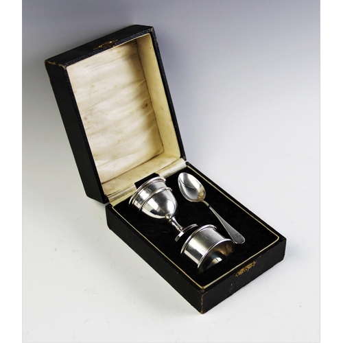 66 - A silver christening set, comprising a weighted egg cup and spoon by S Blanckensee & Son Ltd, Birmin... 