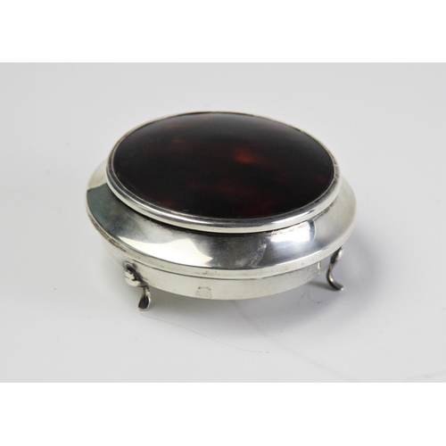 69 - A silver and tortoiseshell powder casket, of compressed circular form on three feet with detachable ... 