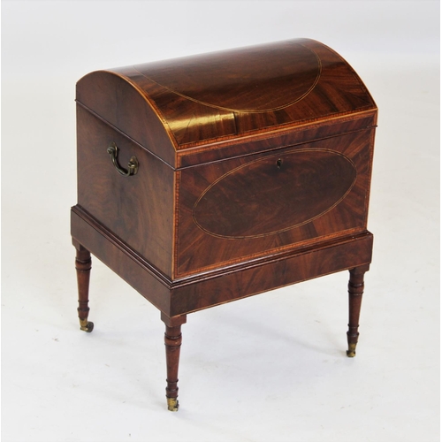 834 - A George III domed mahogany cellarette, the satinwood cross banded hinged cover enclosing a divided ... 