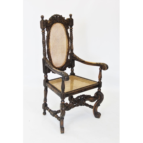 842 - A Victorian carolean style carved walnut throne chair, the profusely carved scrolling leafy frame en... 