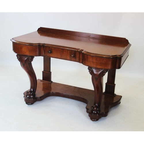 858 - A Victorian mahogany dressing table, the invert shaped moulded top above a single frieze drawer, rai... 