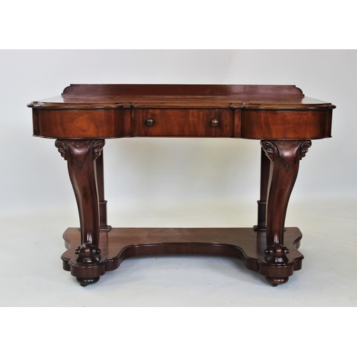 858 - A Victorian mahogany dressing table, the invert shaped moulded top above a single frieze drawer, rai... 