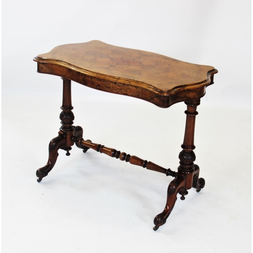 871 - A Victorian burr walnut occasional table, the quarter veneered thumb moulded serpentine top, raised ... 