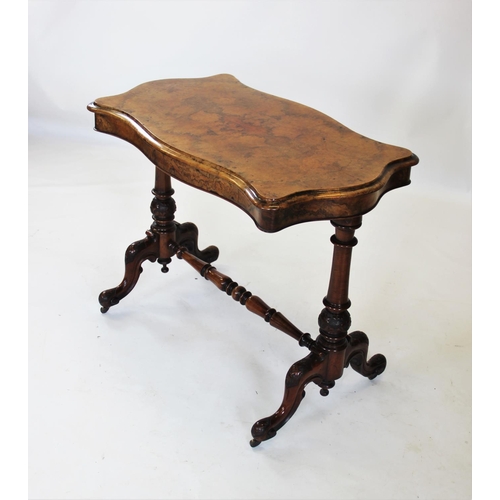 871 - A Victorian burr walnut occasional table, the quarter veneered thumb moulded serpentine top, raised ... 